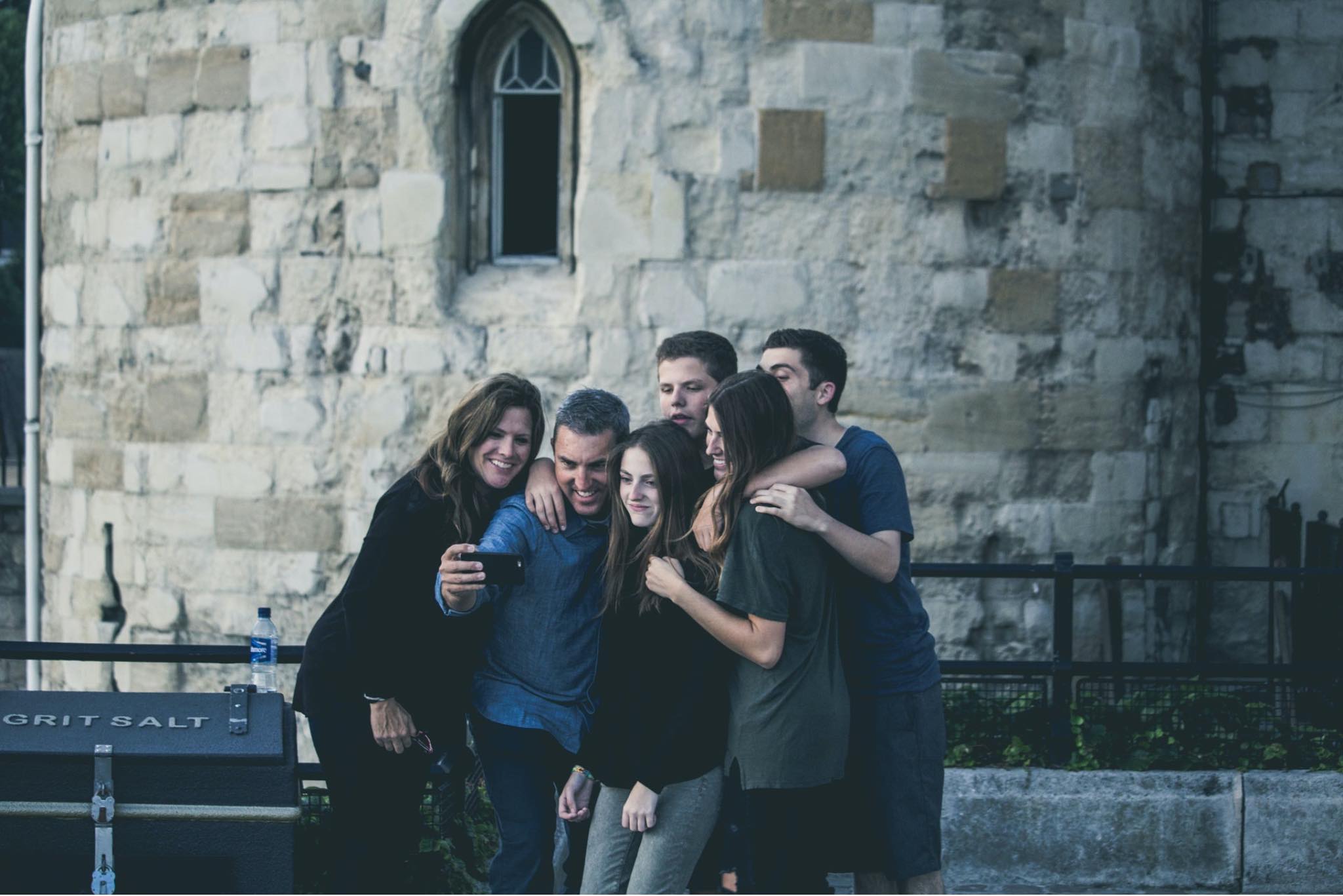 Blended Family stock photo family posing for selfie in front of church