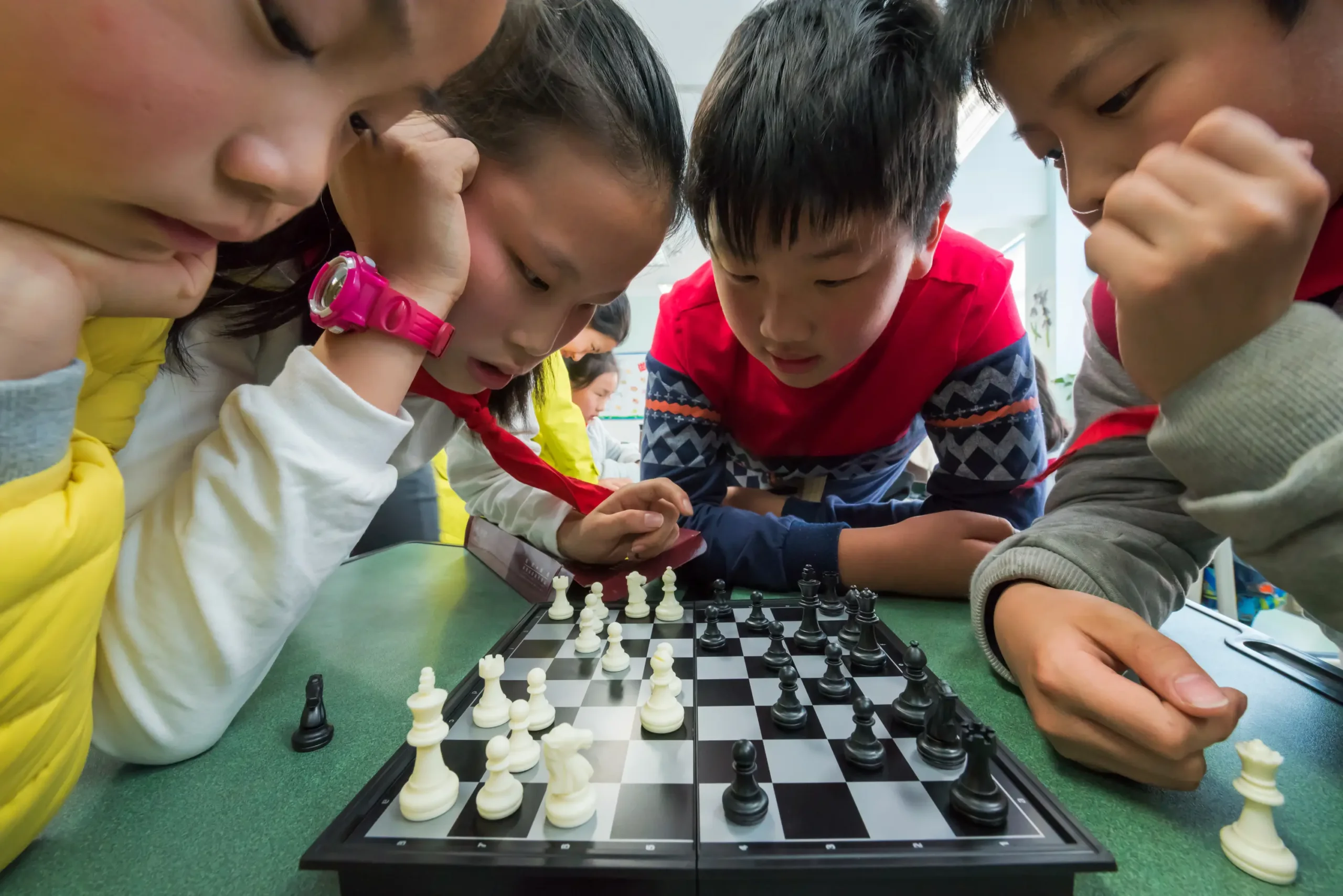 Group of kids playing chess