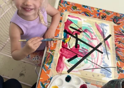 student smiles as she works