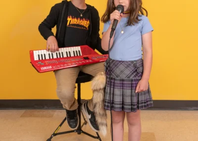 Calvin and Alma performing a song