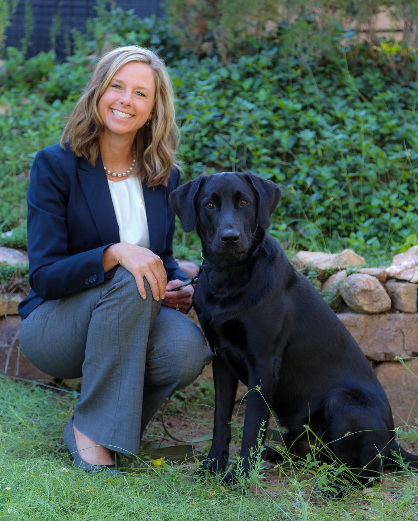 Courtesy photo: Griffin pauses to share a joyful moment with her beloved Labrador, Ollie.