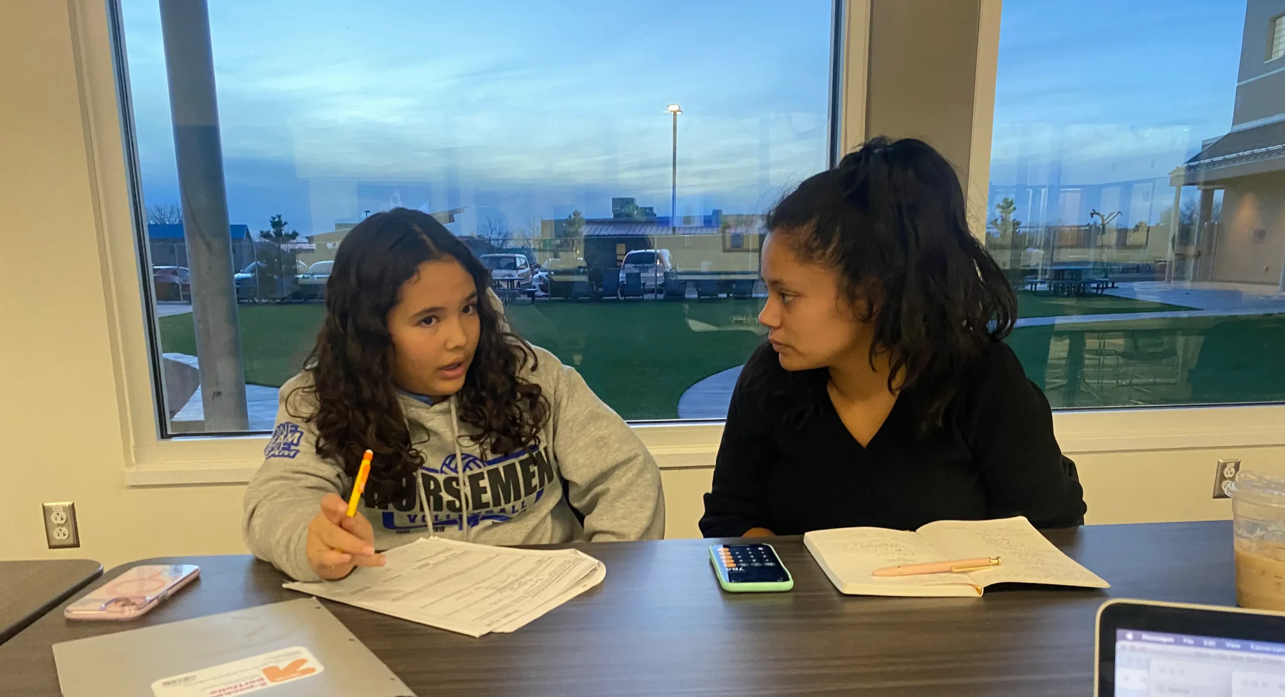 Tutor helping St. Michael’s middle school student prepare for final exam in math. Courtesy photo: Tutor helping St. Michael’s middle school student prepare for final exam in math.