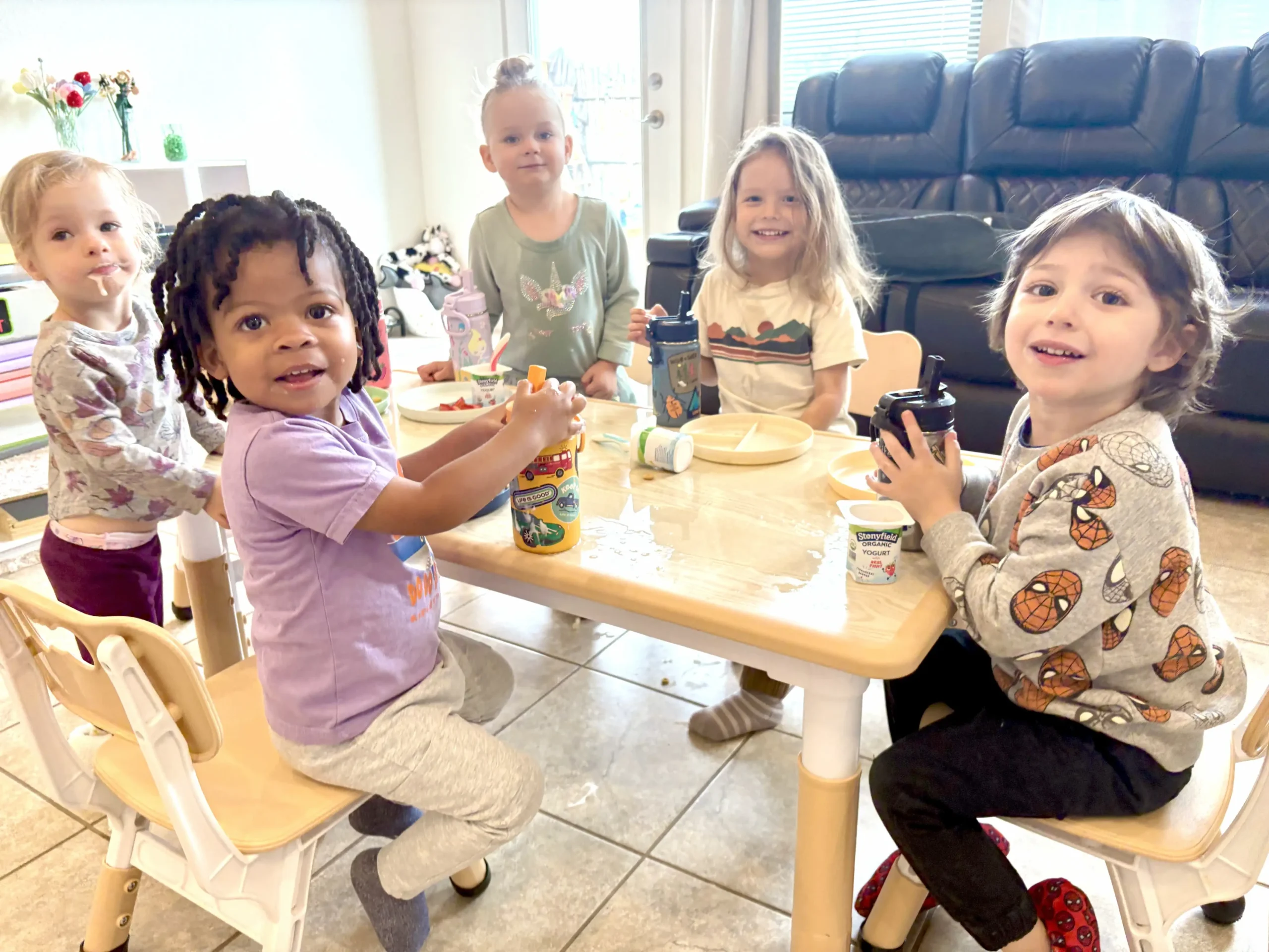 Children at breakfast Courtesy photo: Students gather around the table to share breakfast and start the day.