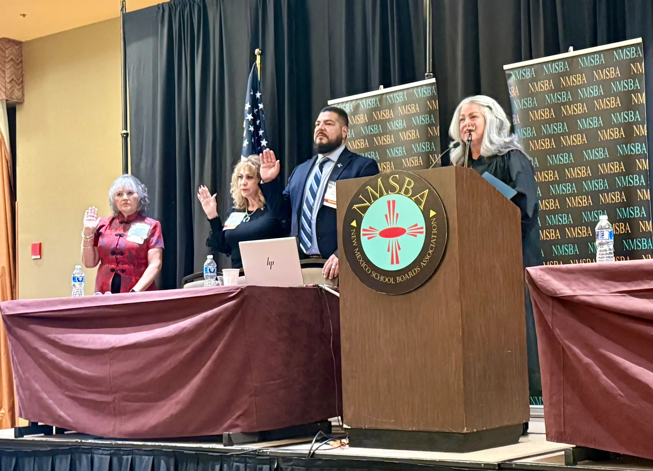 Rio Arriba County Magistrate Judge Alexandra C. Naranjo reads the code of ethics to New Mexico school board members.