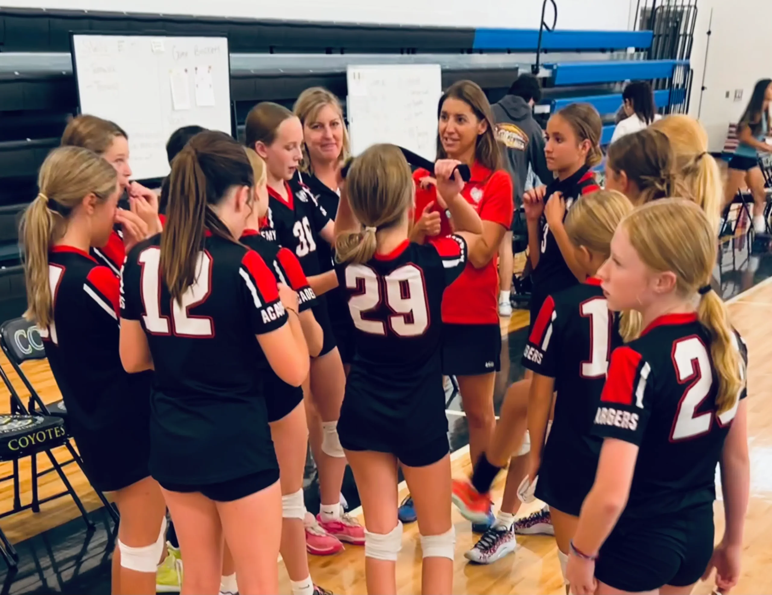 time out 09.24 Coaches Pamela and Marcie bring the team in for a time-out